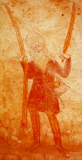 H. Land bedevaarder met palmtakken. Romaans fresco. Tavant, crypte van de romaanse kerk St.-Nicolas